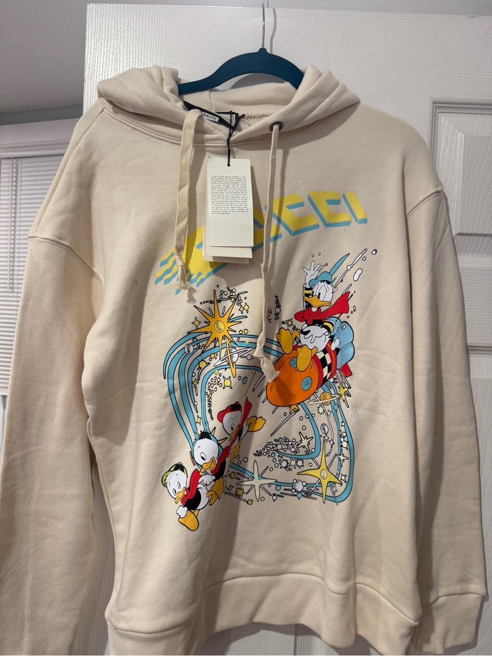 Gucci Cream Cartoon-Graphic Hoodie with Yellow and Blue Accents